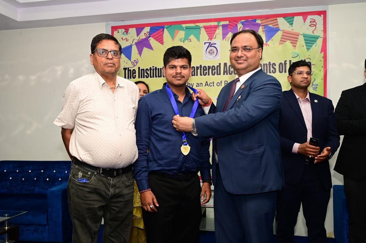 CA Harsh Goel receiving recognition at ICAI event